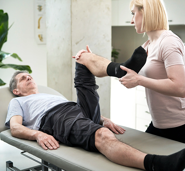 596x552_physical-therapist-working-with-senior-male-patien-2026-03-13-05-50-15-utc